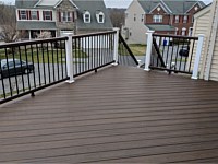 <b>Trex Transcend Spiced Rum Deck Boards in a Diagonal Pattern with Trex composite railing in matching Spiced Rum with white composite posts and black aluminum baluster</b>